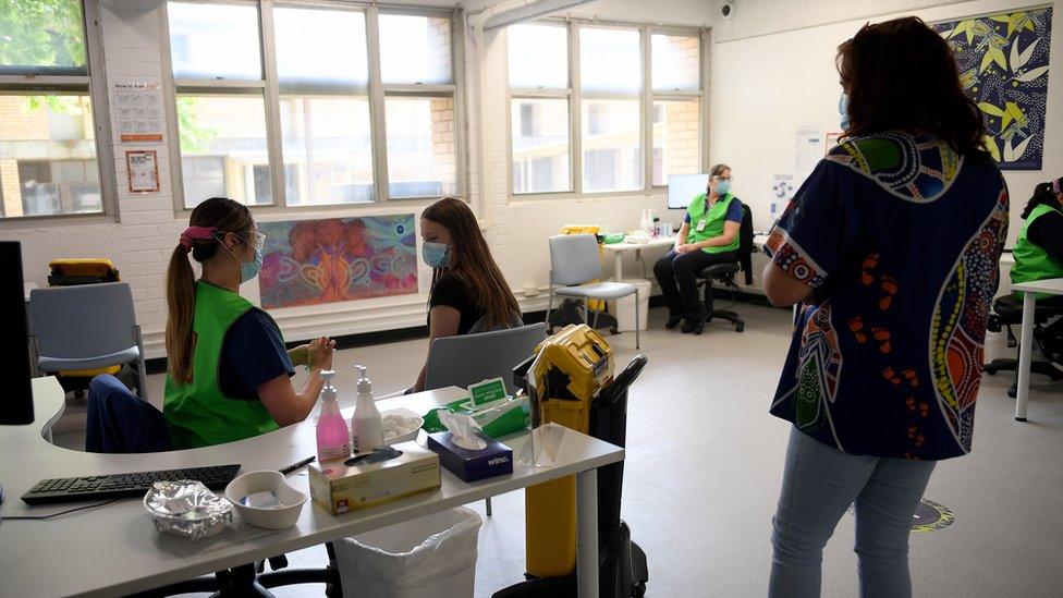 A member of the community receives a dose of COVID-19 vaccine at the Kimberwalli Aboriginal COVID-19 vaccination Hub in Whalan, New South Wales, Australia, 28 September 2021.