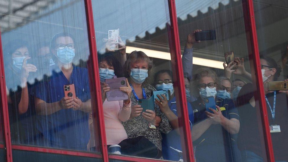 Hospital staff at window