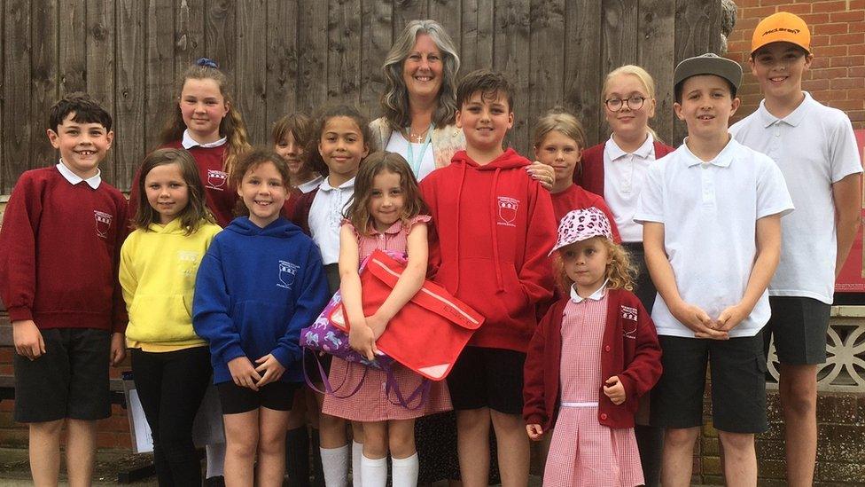 Pupils and headteacher at Sir Robert Hitcham's Primary School in Framlingham, Suffolk