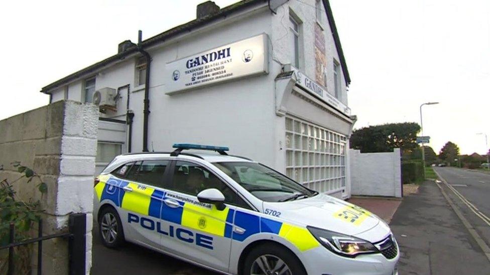 Police car outside Gandhi restaurant