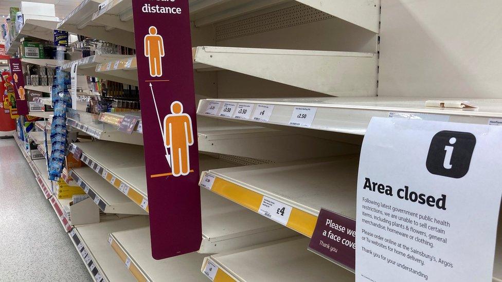 Empty shelves in a supermarket in Tenby