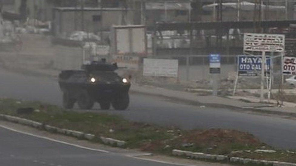 Armoured vehicles of Turkish forces patrol at the south-eastern town of Nusaybin, Turkey, near the border with Syria (14 February 2016)