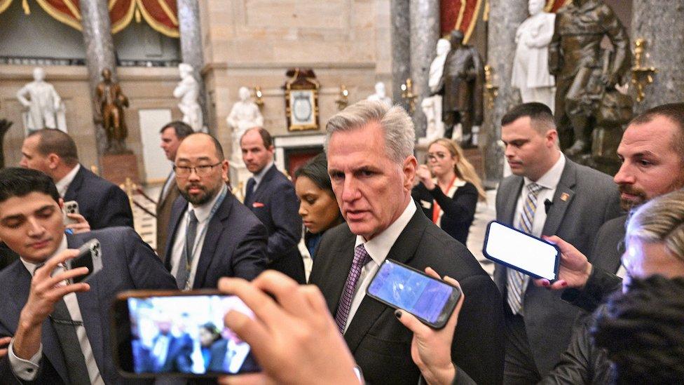 Kevin McCarthy surrounded by phone cameras