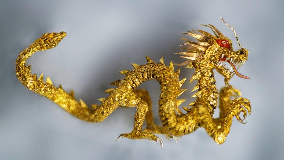 Tiny golden dragon up close