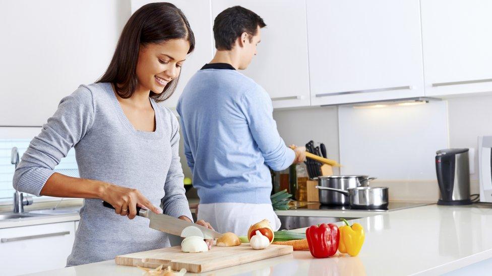 Man and woman cooking in the kitchen