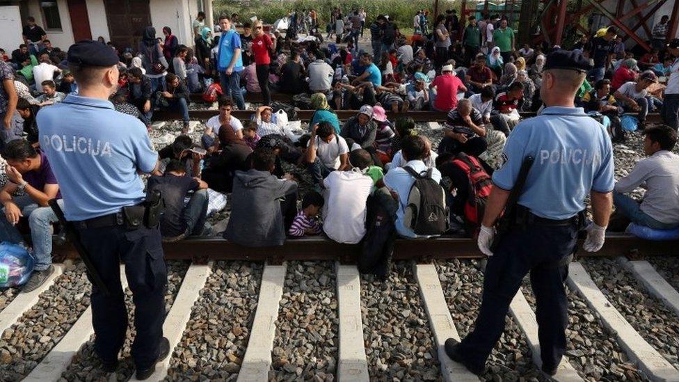 Migrants wait for train at Croatian border station of Tovarnik - 17 September