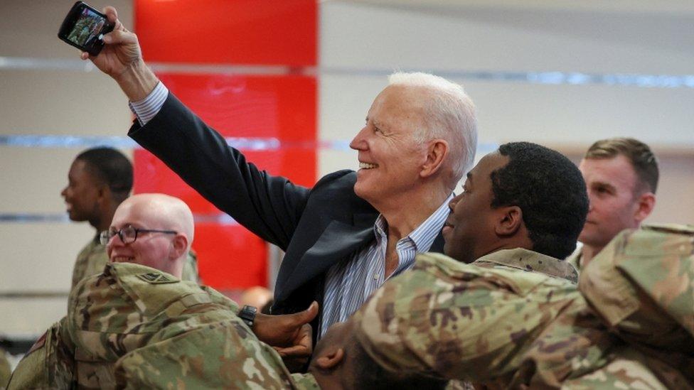 Image shows Joe Biden with US soldier