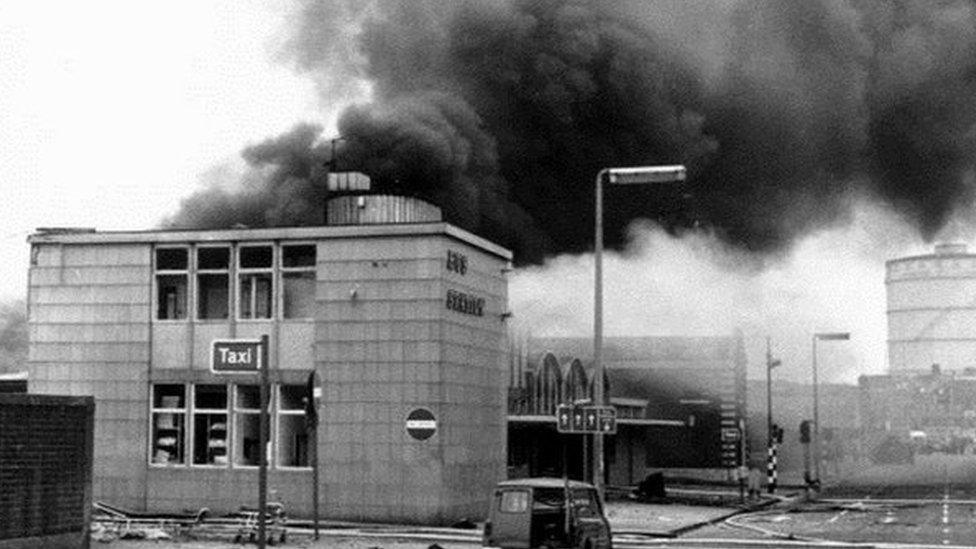 Smoke rises over Oxford Bus Station in Belfast on Bloody Friday