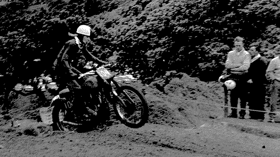 Colin Burrow riding his bike as a young man