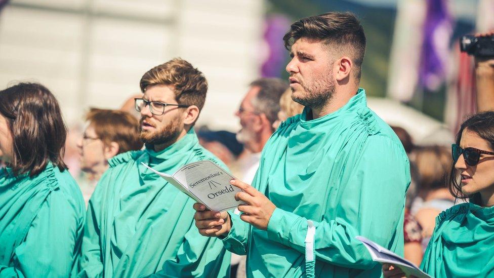 X Factor competitor, Lloyd Macey, in his green robes