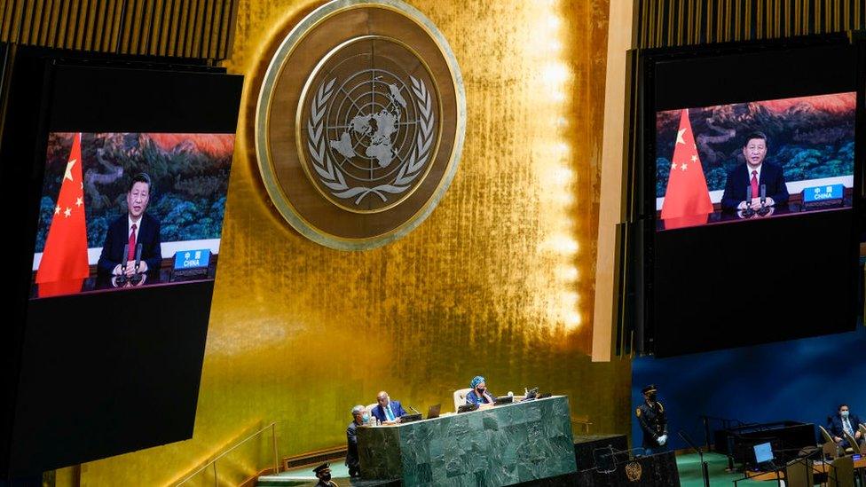 Chinese President Xi Jinping is seen on a video screen as he addresses the annual gathering in New York City