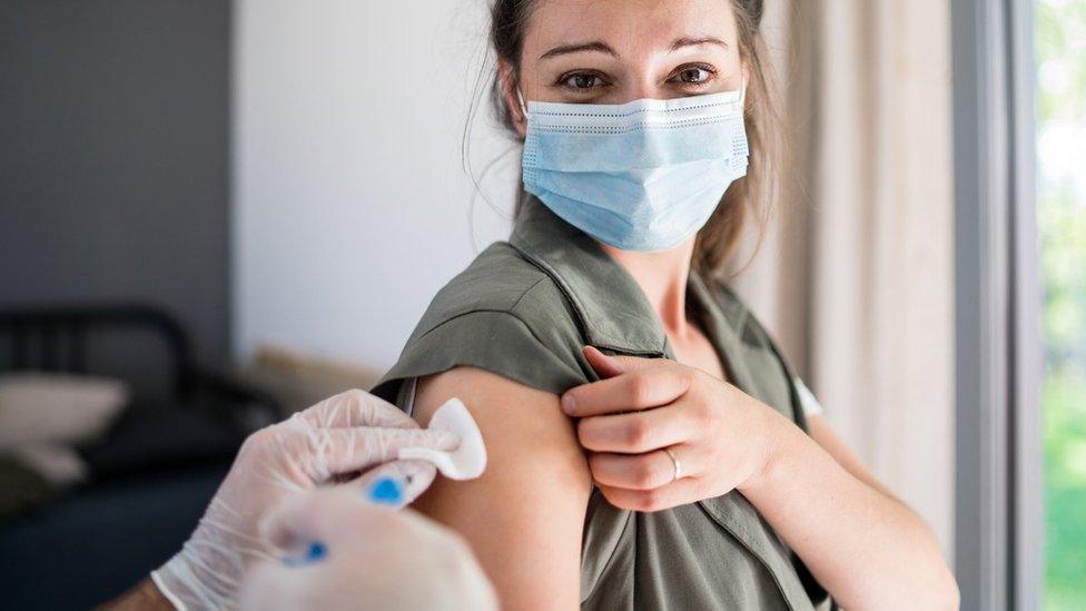 Woman being vaccinated