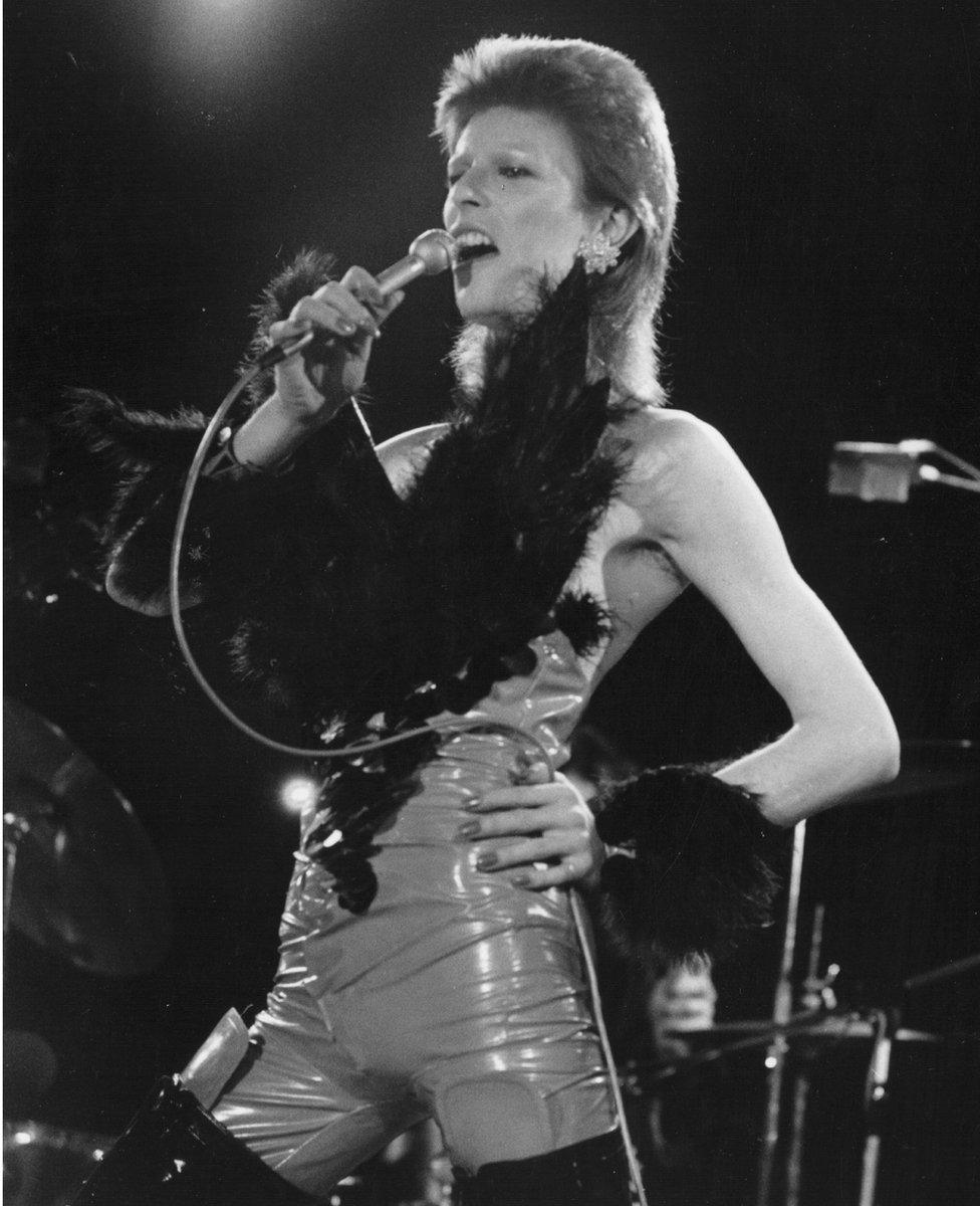 David Bowie performing in his 'Angel of Death' costume at a live recording for a Midnight Special TV show made at The Marquee Club in London to a specially invited audience of Bowie fanclub members in 1973