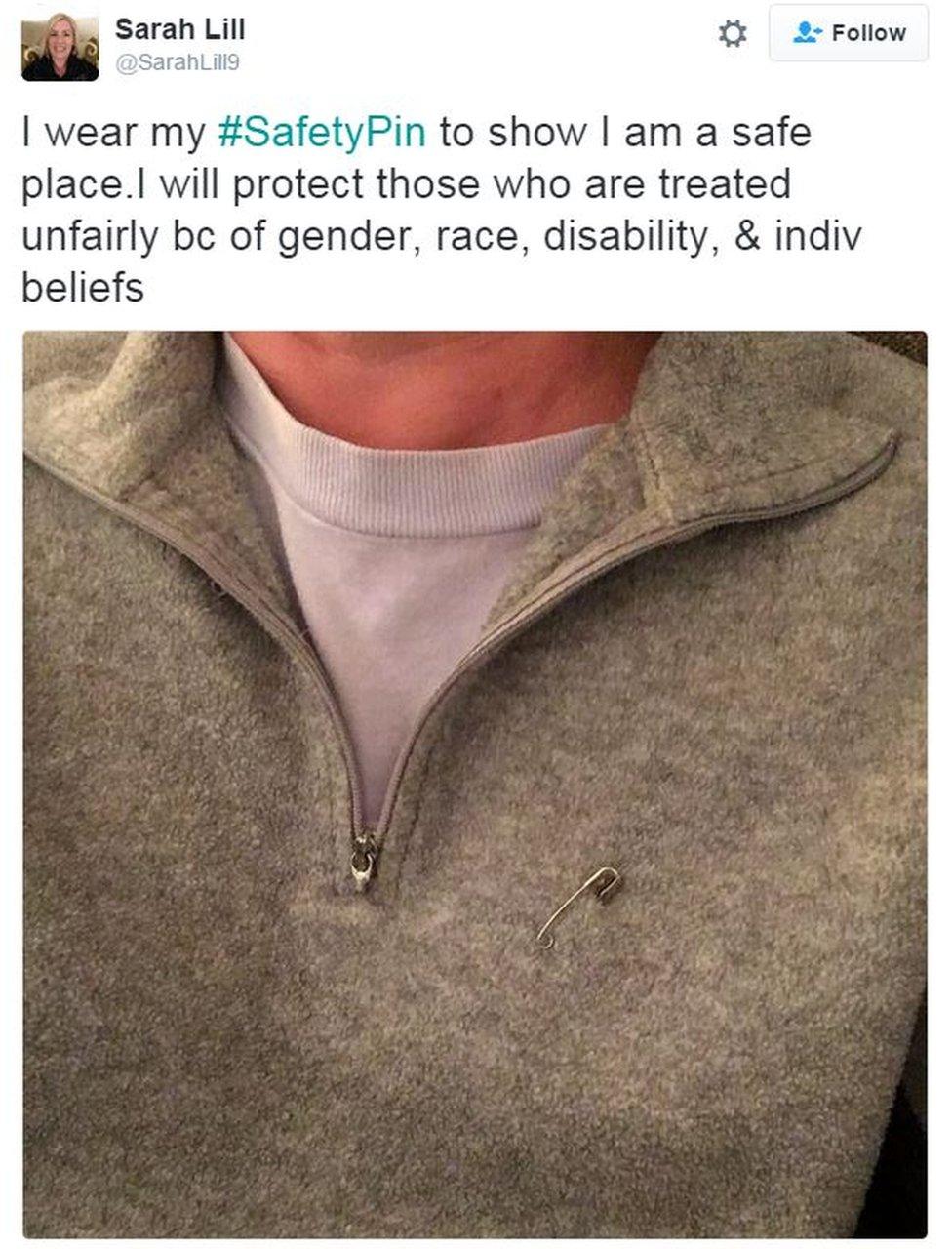 Tweet from user SarahLill9 reads: "I wear my SafetyPin to show I am a safe place. I will protect those who are treated unfairly because of gender, race, disability and individual beliefs" and shows a picture of her wearing a safety pin