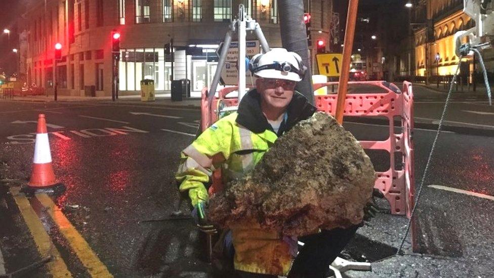 A mass of wet wipes being removed from a sewer