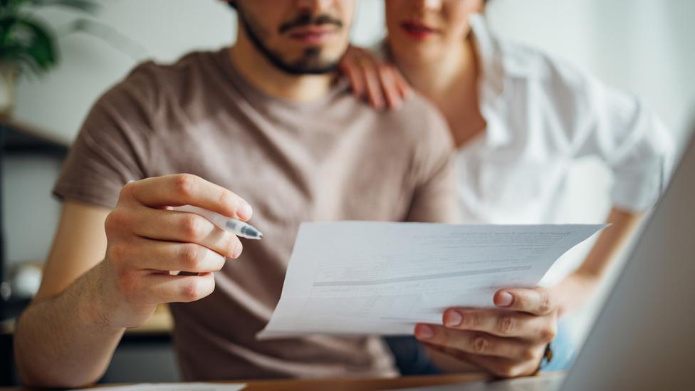 Couple looking at a bill