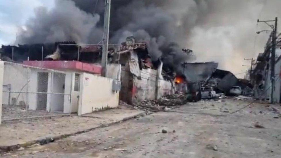 In this screen-grab, obtained from social media, smoke billows out of a building, following the explosion in San Cristobal, Dominican Republic - 14 August 2023