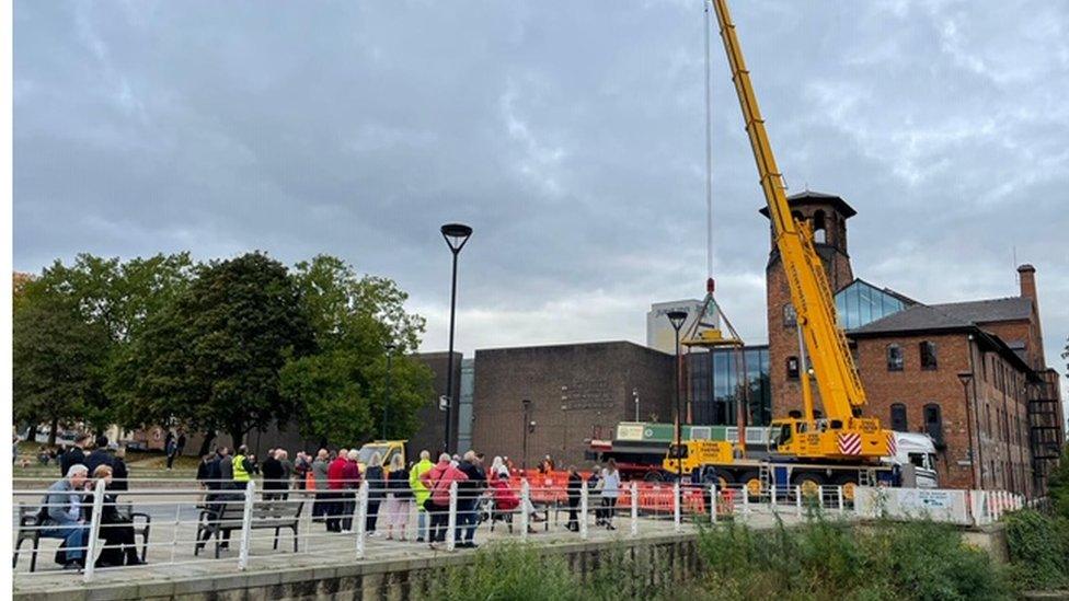 Outram being lowered into the River Derwent