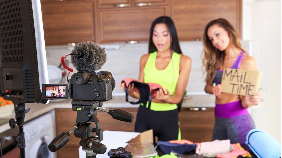 Women recording on camera