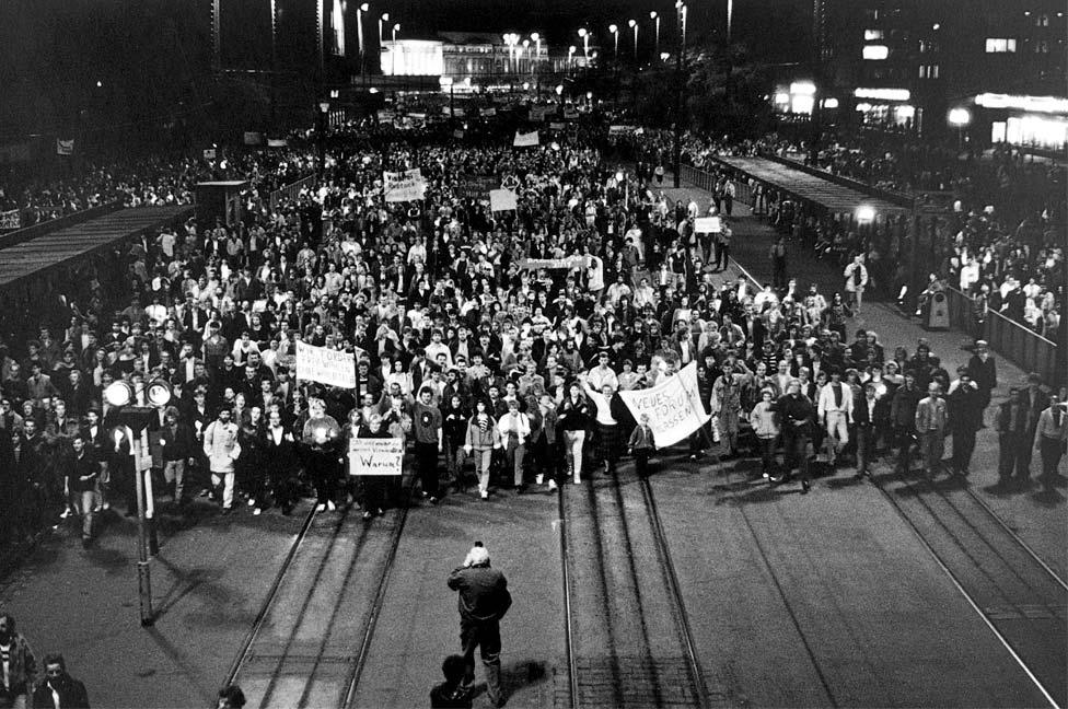 Demonstrators march through Leipzig in 1989