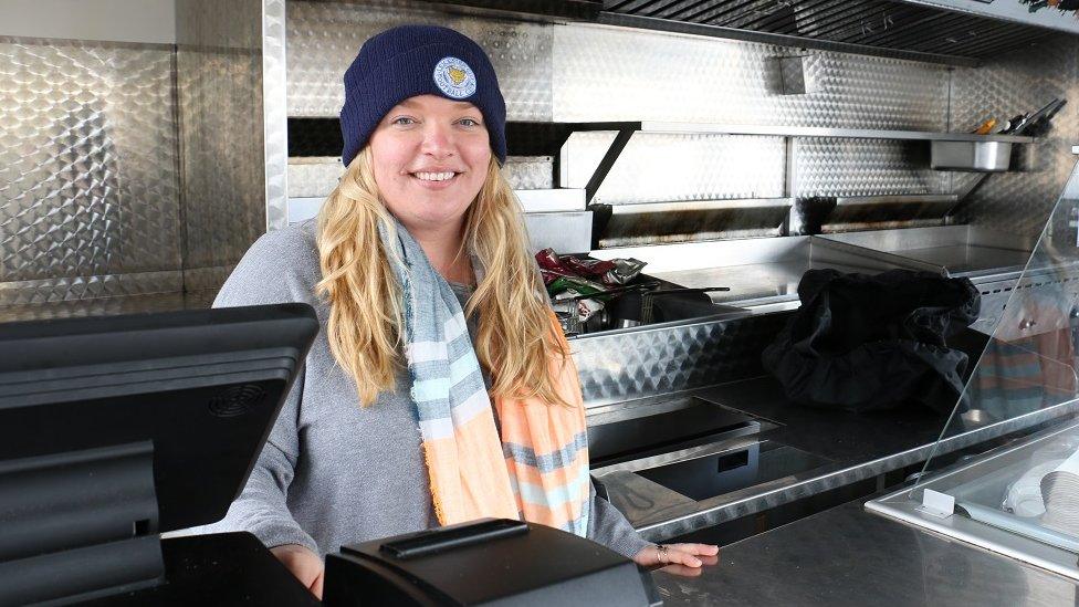 Nicky Fitzpatrick standing behind the counter in a catering van