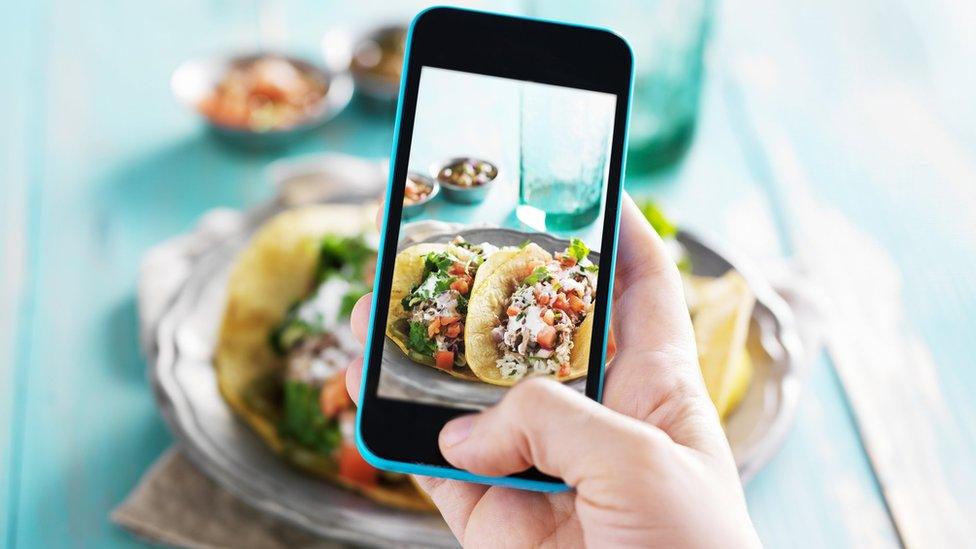 Taking a photo of tacos with a phone