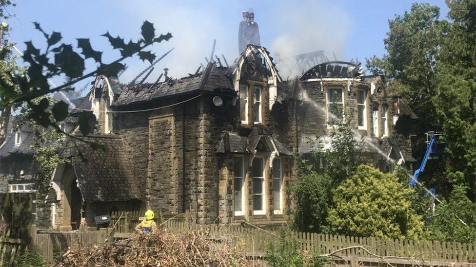 Firefighters extinguish a blaze at Dolgerddon Hall, Rhayader