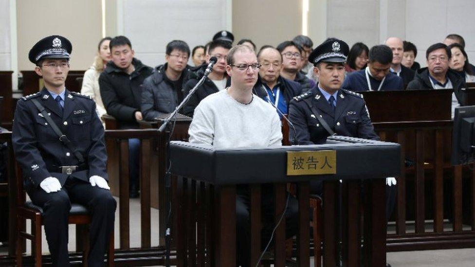 Robert Lloyd Schellenberg (centre) listens during his retrial in Dalian's court. Photo: 14 January 2019