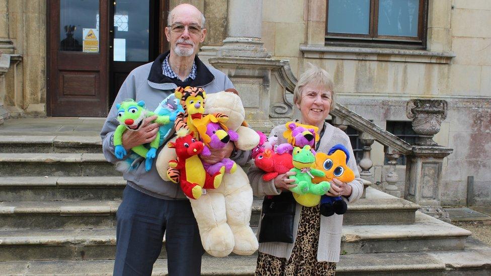 Roy and Ann Pettitt with a number of toys