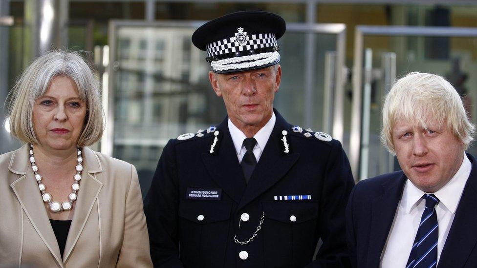 Britain's then Home Secretary Theresa May and then Mayor of London Boris Johnson with the newly appointed commissioner of the Metropolitan Police Bernard Hogan-Howe on September 12, 2011