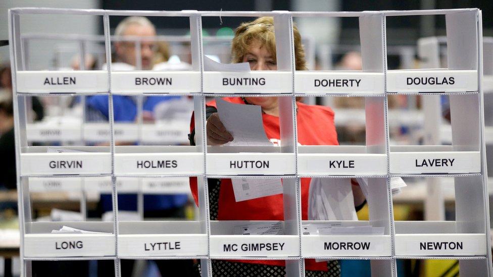 A count supervisor sorts voting papers at the Belfast centre