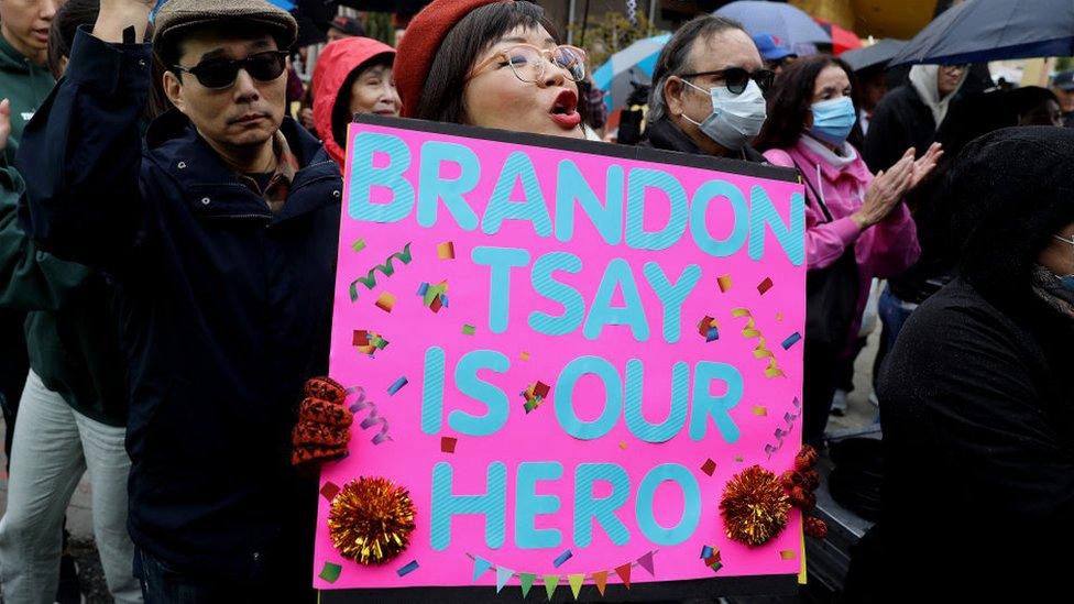 A supporter cheers at a Lunar New Year celebration where Brandon Tsay was honoured.