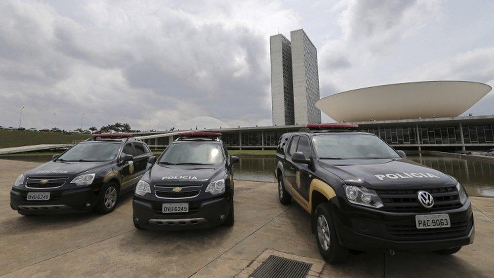 Senate police cars outside the Congress building in Brasilia, October 2016