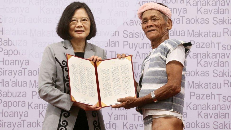 Taiwan"s President Tsai Ing-wen (L) poses with 80-year-old indigenous Yami leader Capen Nganaen (R) during a ceremony at the Presidential Office building in Taipei on August 1, 2016