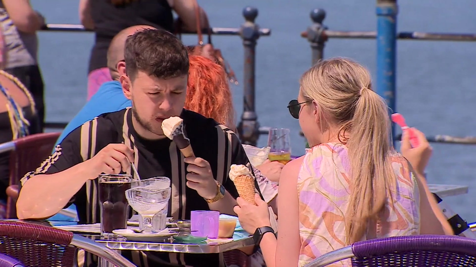 People enjoying al fresco dining at Langland Bay