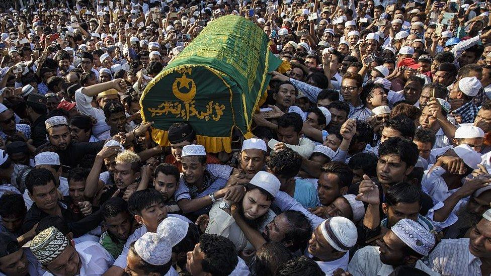 People carry the coffin of a prominent Muslim lawyer Ko Ni