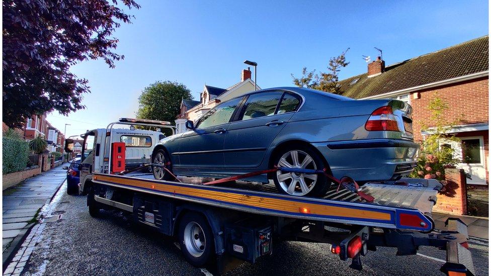 Car being towed away