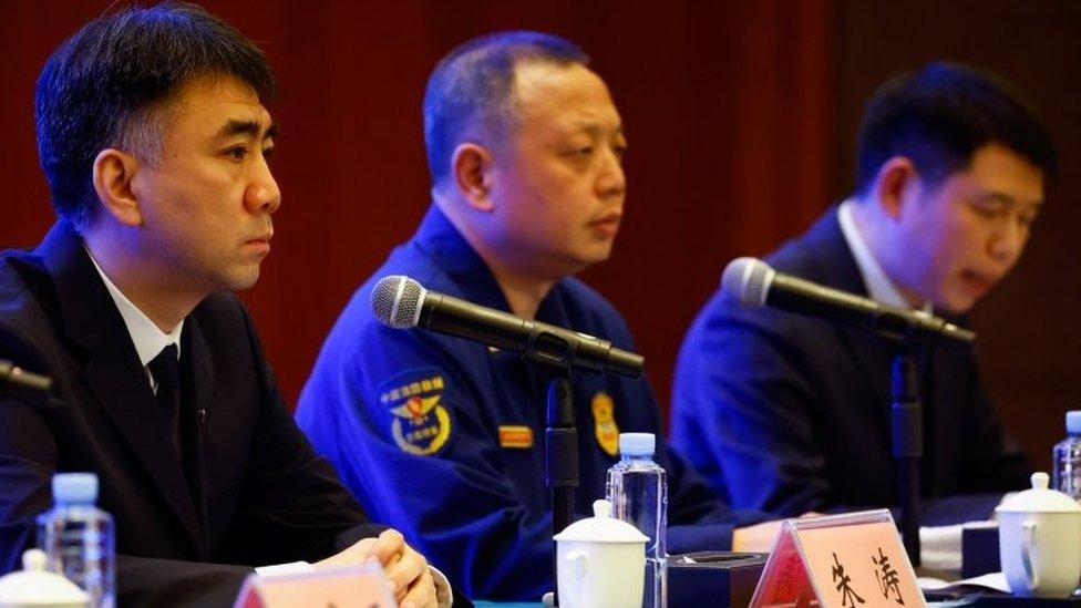 (L-R) Zhu Tao, official with Office of Aviation Safety under the Civil Aviation Administration of China (CAAC), Zheng Xi, chief of the Fire and Rescue Corps of Guangxi Zhuang Autonomous Region and Shangguan Xuemin, official with China Eastern Airlines