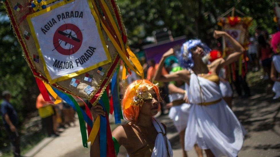 Revellers wearing Greek style costumes call for prevention against the Zika virus in the first carnival ""Bloco"" (street parade group) under the theme ""Rio: The Olympics are here"" on the streets of Rio de Janeiro, Brazil on January 23, 2016. AFP