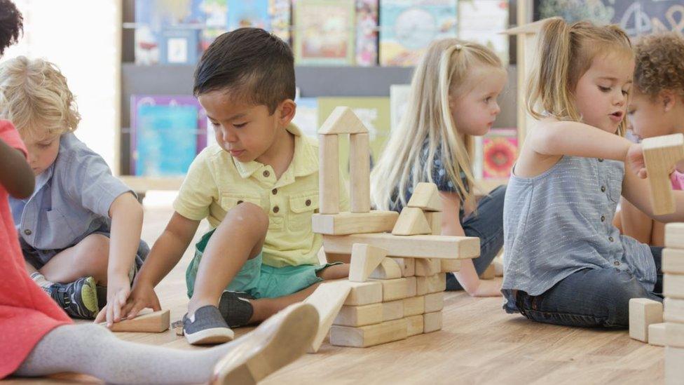 children playing in a nursery class