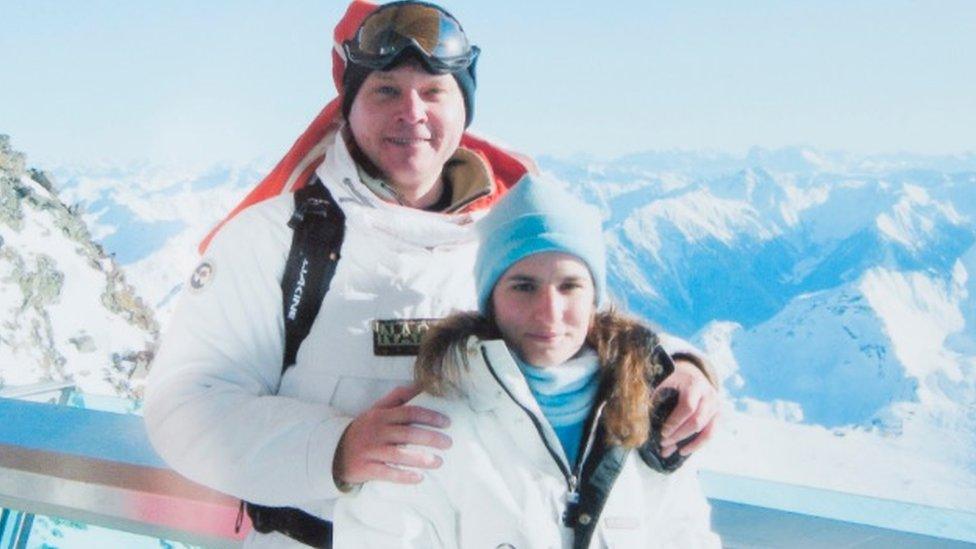 rebekah and her husband in ski gear