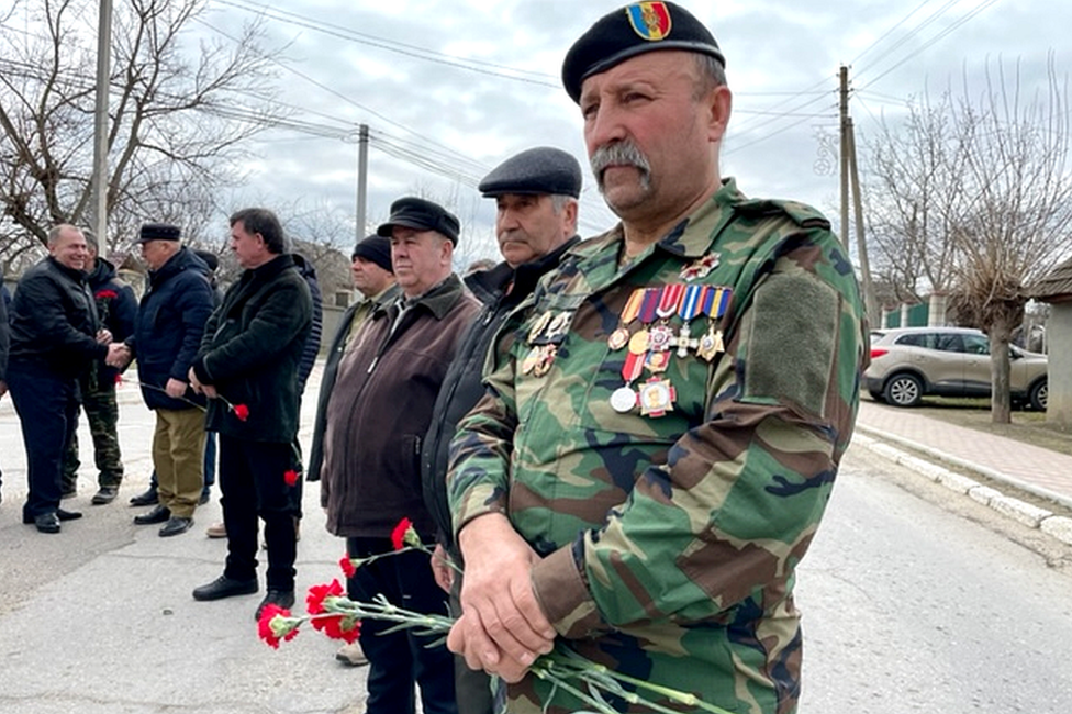 Vlad Untila attends a ceremony in the village of Molovata Noua