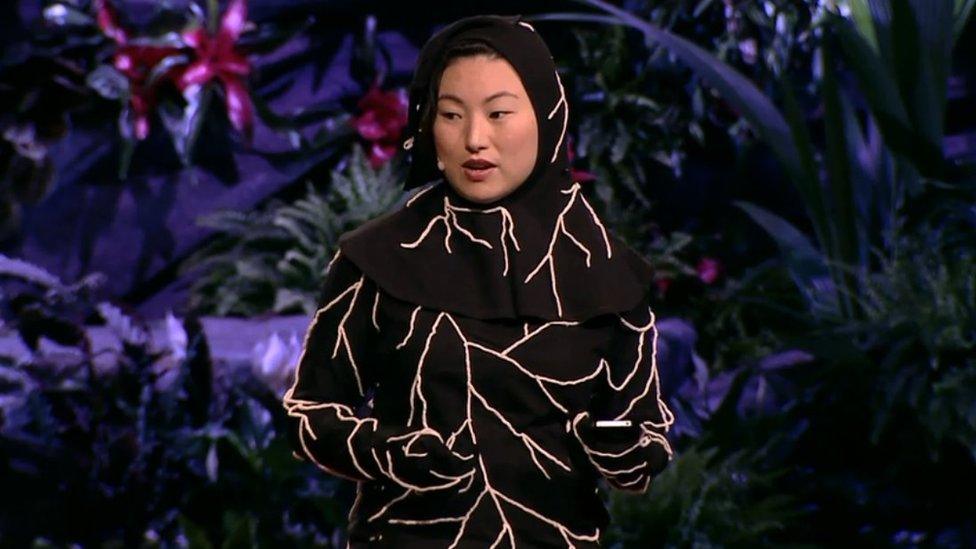 Jae Rhim Lee wearing an early version of the mushroom suit during a TED talk in 2011