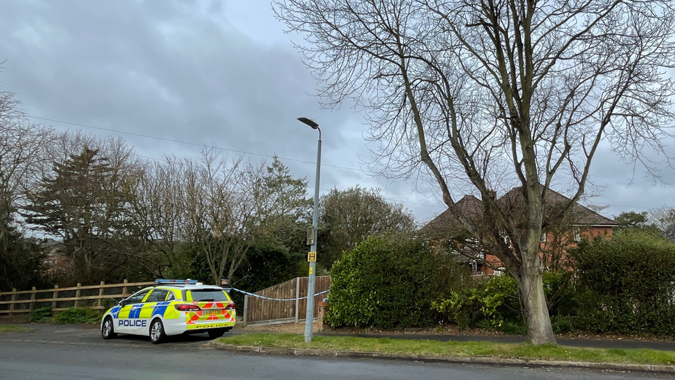 A police car outside a property in The Warren, Cromer, Norfolk