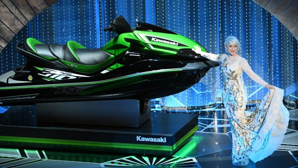 Helen Mirren poses with a jet ski