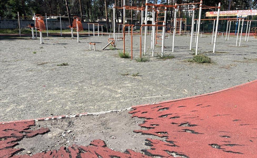 A small crater in the playground of Irpin Lyceum #3, a school