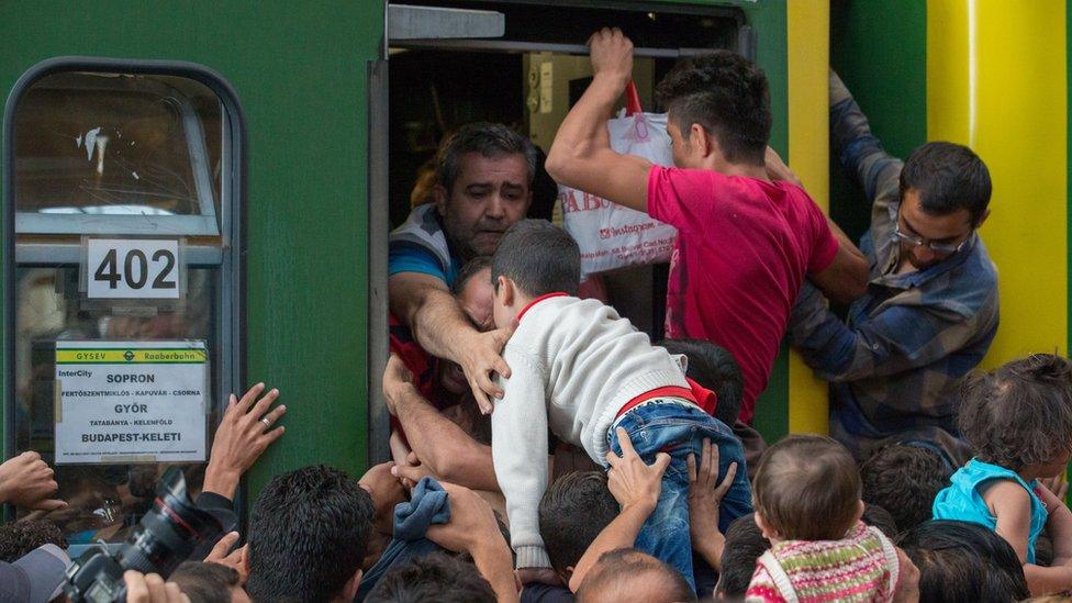 Migrants squeezing onto a train in central Budapest, 3 Sep 15