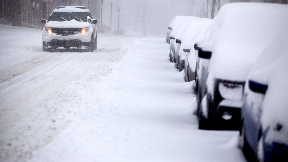 A WKU police vehicle drives through the snow on Kentucky Street.