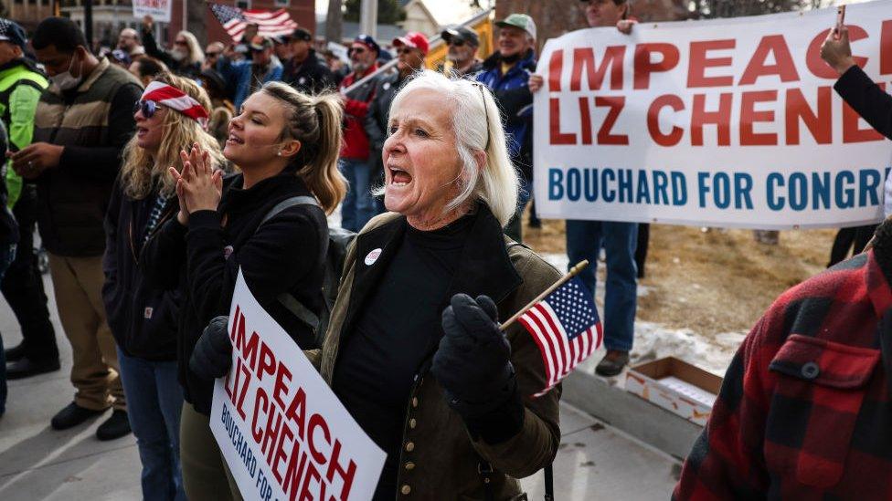 People cheer as Rep. Matt Gaetz speaks to a crowd during a rally against Liz Cheney on 28 January in Wyoming