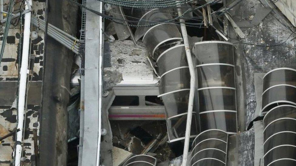 A derailed New Jersey Transit train is seen under a collapsed roof after it derailed and crashed into the station in Hoboken, New Jersey, U.S